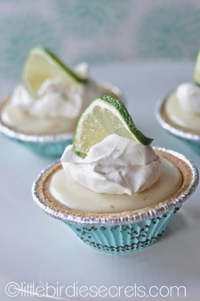 mini key lime pies with lime and whip cream garnish