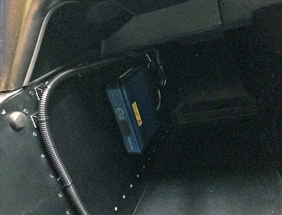 VBOX HD2 in Caterham passenger footwell with corrugated tubing keeping everything neat and tidy