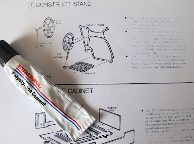 Instructions for a dolls' house miniature treadle sewing machine, with a tube of glue.