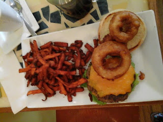 Batter & Berries Burger with onion rings and sweet potato fries Batter & Berries
