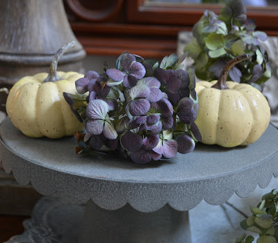 Tiered fall display with hydrangeas and baby boos