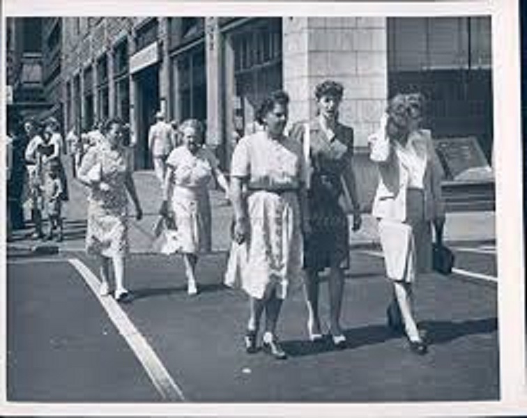 1947. Heading home after a hard day at the shop