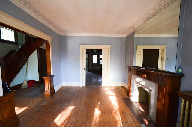 #projectrad: 1909 powder blue living room with fireplace and bay windows