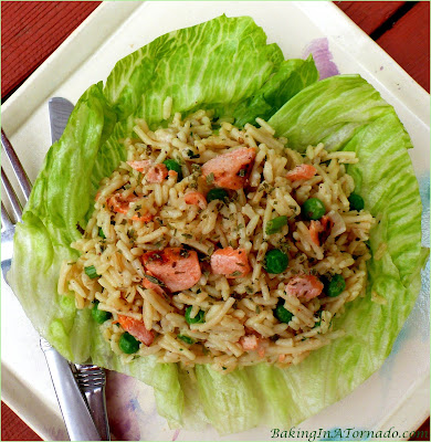 A cool meal for a hot day, Parmesan Balsamic Salmon Salad marries balsamic and parmesan flavors with rice, peas and grilled salmon. | Recipe developed by www.BakingInATornado.com | #recipe #lunch