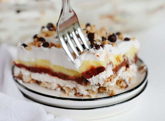 So simple... so fun! This old fashioned dessert was made popular at church potlucks and stayed popular for a reason! #dessert Dessert, Pudding, Cream Cheese, Pecans, #pecans #baking, #iambaker