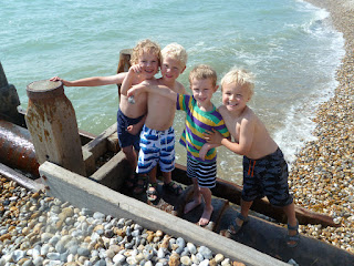 happy children playing with rocks