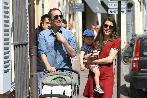 Charlotte Casiraghi and Gad Elmaleh with their baby Raphael walking and shopping in the streets of Saint-Tropez, France