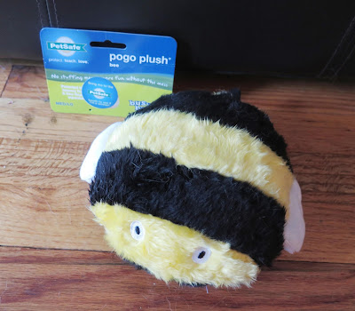 Our dogs really like the PetSafe Pogo Plush bee toy.  It squeeks but has no stuffing so there's no mess!