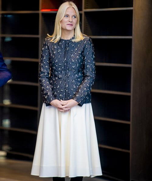 Crown Princess Mette-Marit wore a new silk wool jacket by Brock Collection, and pleated midi skirt. Deichman Library children's books