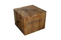 A wooden block with "Composer" written 