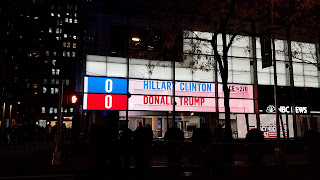 A sign showing Hillary and Donald with 0 electoral votes, each