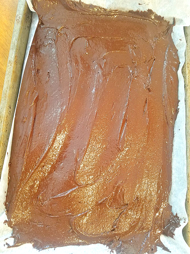 this is a batter with dark chocolate fudge cake mix and brownie mix together for a rich fudge cake to be baked