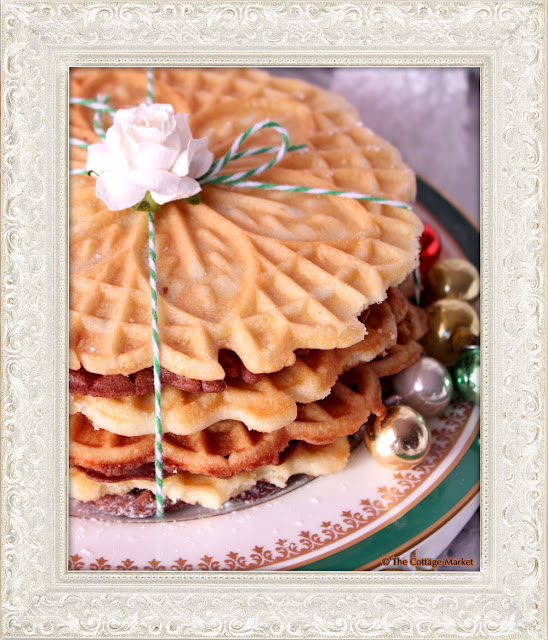 These homemade pizzelles bunched together with string and a flower are festive.