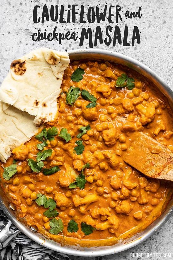 This super easy, ultra creamy, and heavily spiced Cauliflower and Chickpea Masala will be your new favorite weeknight dinner! So much flavor, so little effort. Budgetbytes.com #vegetarian #dinner