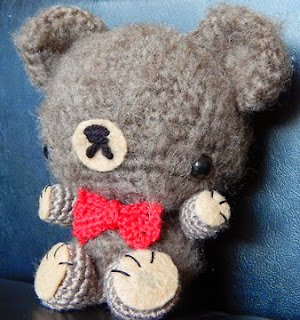 http://yarnplanet.tumblr.com/post/49516732846/mini-bowtie-bear-pattern-sometime-ago-some