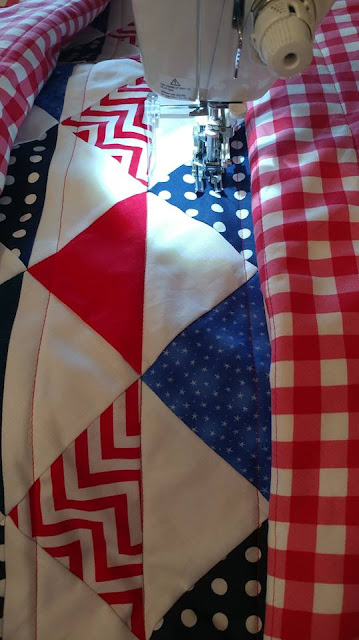 Red, white, and blue half square triangle (HST) quilt