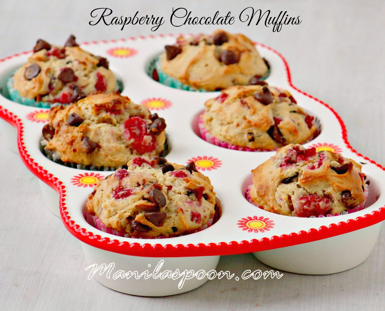 Fresh raspberries provide a sweet-tangy contrast to chocolate in these more-ish, moist and totally scrumptious muffins! Great for breakfast or anytime you feel like snacking. #raspberry #chocolate #muffins