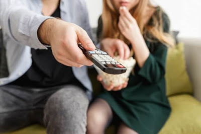 Parent and kid watching TV