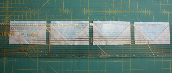 Trimming flying geese | DevotedQuilter.blogspot.com
