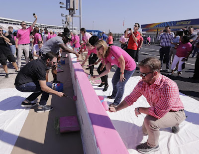 Jimmie Johnson, DeAngelo Williams and NASCAR Drivers Join Breast Cancer Survivors to Paint Pit Wall Pink