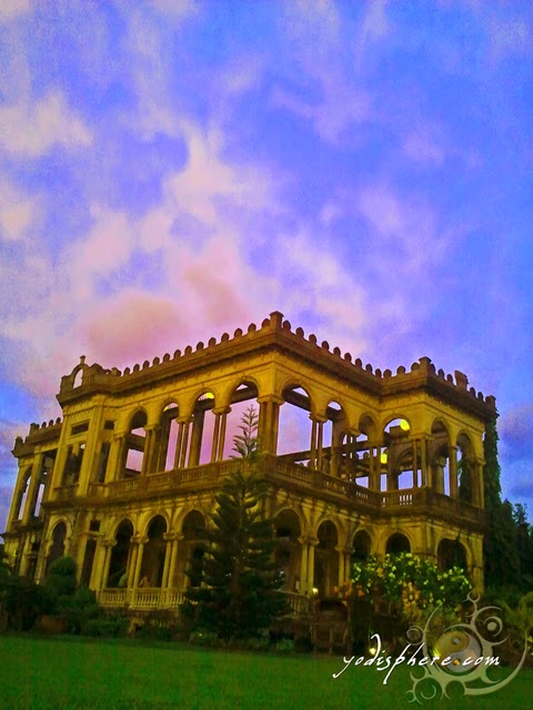 hover_share Golden color of The Ruins against the colorful sky.