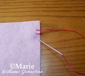 step 5 demonstrating hand sewing stitch