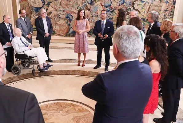 Queen Letizia wore a v-neck zig-zag print midi dress by Carolina Herrera and Lodi burgundy suede ankle strap pumps