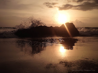Sunset View With Ocean Waves Hitting Rocks At Batu Bolong Beach, Canggu Village, Badung, Bali, Indonesia