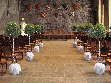 wedding aisle lined with bay trees 