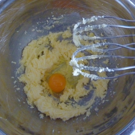 mixing butter sugar egg with mixer whisks