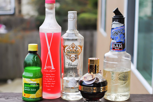santa's kiss cocktail, whipped vodka, lemon juice, simple syrup, chambord, black raspberry liqueur, x-rated fusion liqueur