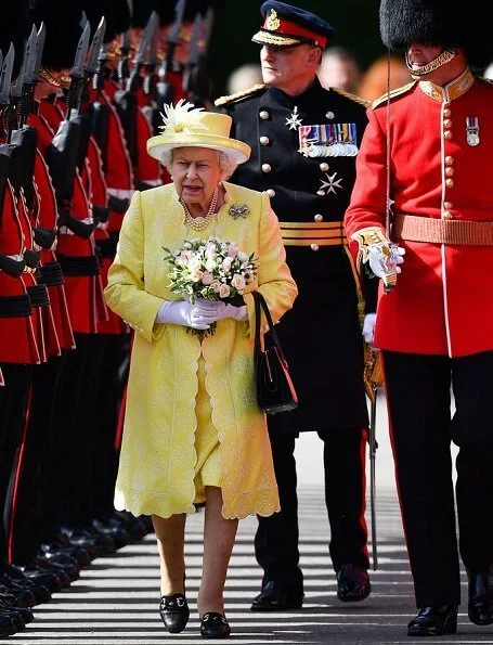 The traditional 'Ceremony of the Keys' took place tonight at Holyroodhouse in Edinburgh. yellow dress, jcoat and hat