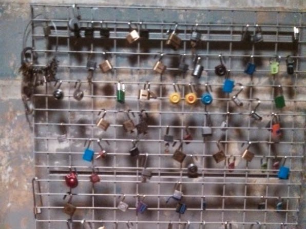 Locks on the wall in CBS Elementary Season 3 Episode 1 Enough Nemesis To Go Around Jonny Lee Miler Sherlock Holmes locks on the wall in CBS Elementary Season 3 Episode 1 Enough Nemesis To Go Around