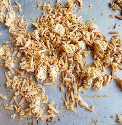 toasted ramen noodle and almond sliver crunchies on baking sheet