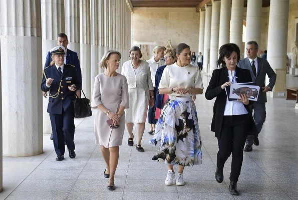 Crown Princess is wearing pleated printed silk midi skirt, and silk shirt half sleeve top at Ancient Agora Museum