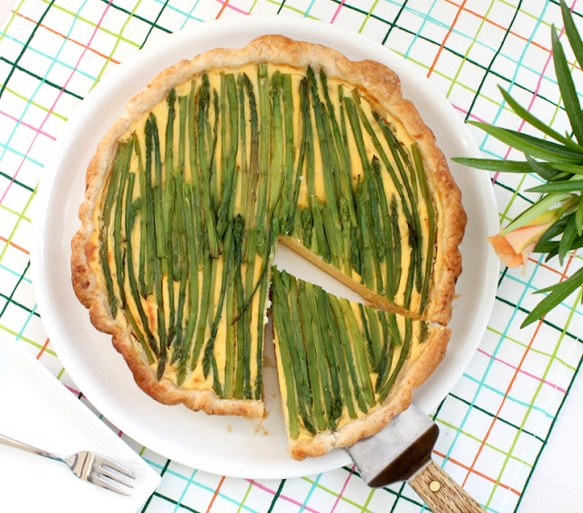 Food Lust People Love: This cheesy asparagus potato tart takes three of my favorite things – crisp puff pastry, cheesy mashed potatoes made with creamy yogurt, and fresh asparagus – and turns them into so much more than the sum of three tasty parts.