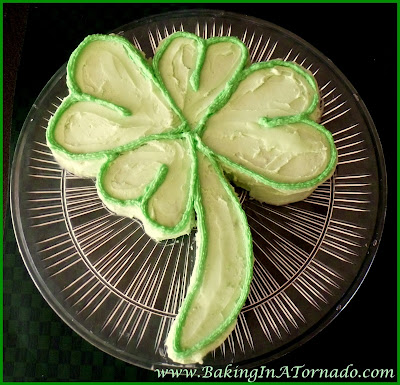 Creme de Menthe Shamrock Cake, a mint flavored, four leaf clover shaped St. Patrick's Day lucky cake.| Recipe developed by www.BakingInATornado.com | #recipe #cookies #StPatricksDay