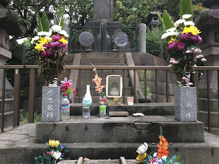 The altar of the Tomb of Shogitai Warriors, front, with offerings, and the actual tomb behind