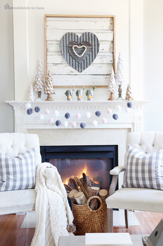 family room fireplace with rustic mantel display to celebrate Valentines day