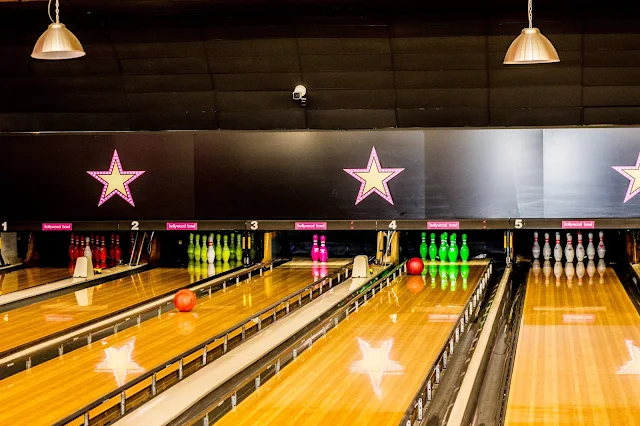 View of the Hollywood Bowl VIP lanes with balls heading towards the pins