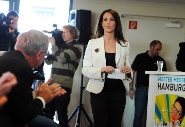 Princess Marie arrived at the fair with the Rector of the University of Southern Denmark. wore blazer and black trousers, diamond earrings