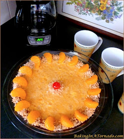 Tropical Fruit Pie: walnut crust, creamy orange pineapple center and garnished with toasted coconut | Recipe developed by www.BakingInATornado.com | #recipe #dessert