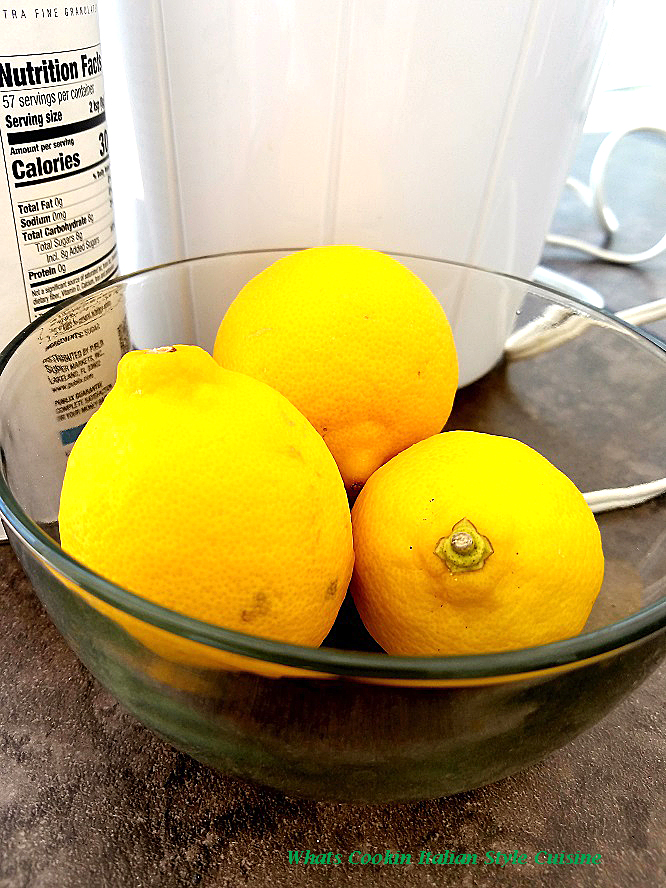 This is a photo of fresh lemons used to make Italian lemon ice in an ice cream maker with sugar and water syrup