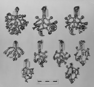 Italian cimaruta Several Silver amulets shaped as crescent moons and with a sprig of rue