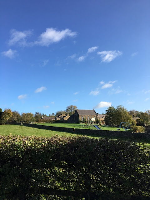 Wrapping Up England: Beeley village school green grass, blue sky, stone houses, drystone wall