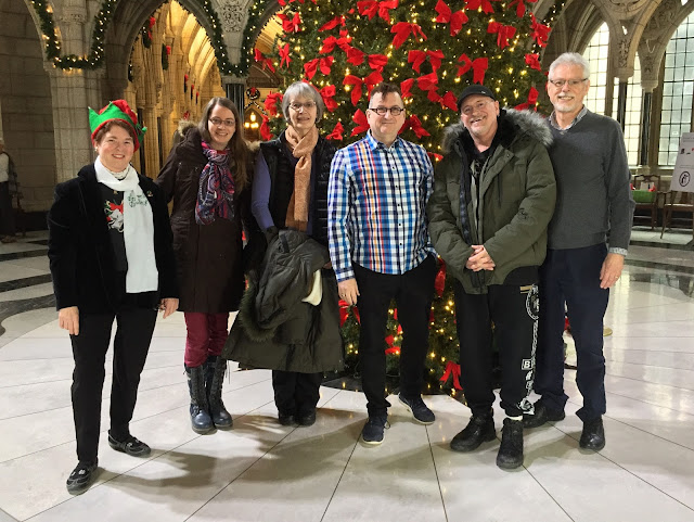 Andrea (in Xmas gear) poses with carillon group Kristina, Michèle, Terry, Pierre and René 