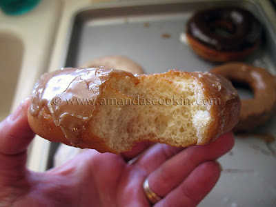 A photo of a half eaten homemade doughnut.