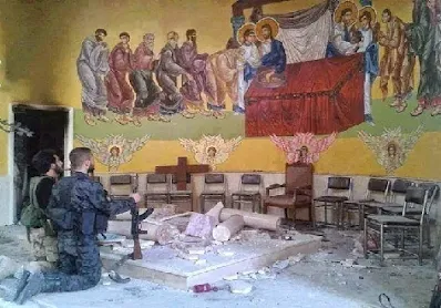 Soldiers in Syria kneeling before our Lord in a desecrated church at a church in Maaloula, Syria 2014 Orthodox Christian Network