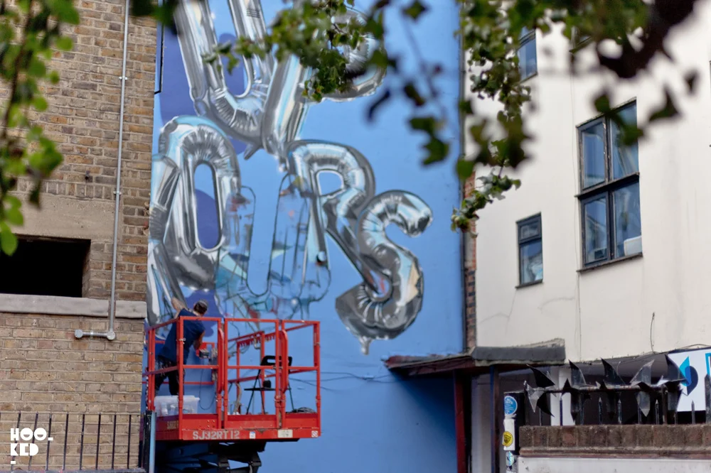 Hyper-realistic 'Up Yours'  helium balloon graffiti  Mural by street and graffiti artist Fanakapan