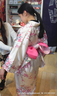 Putting a casual kimono on girl
